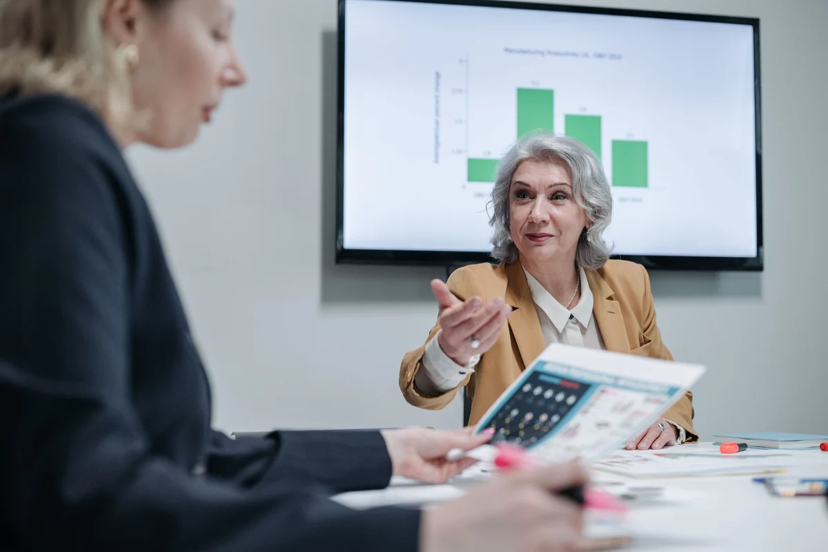 Two business professionals discussing a strategy at a table